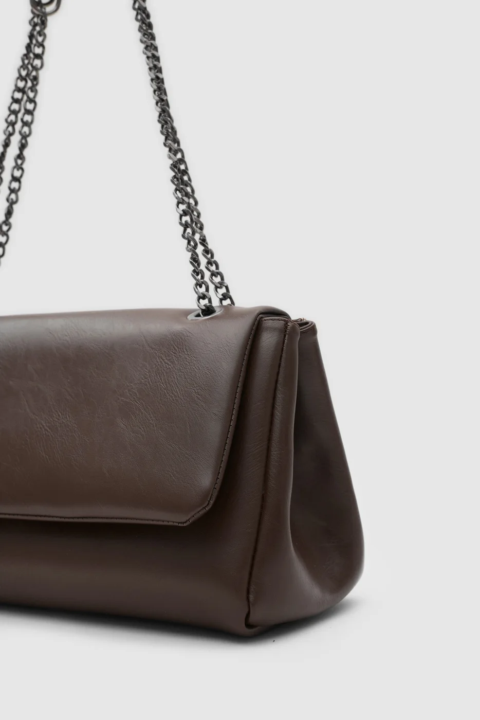 Faux leather shoulder bag with chain strap in dark brown