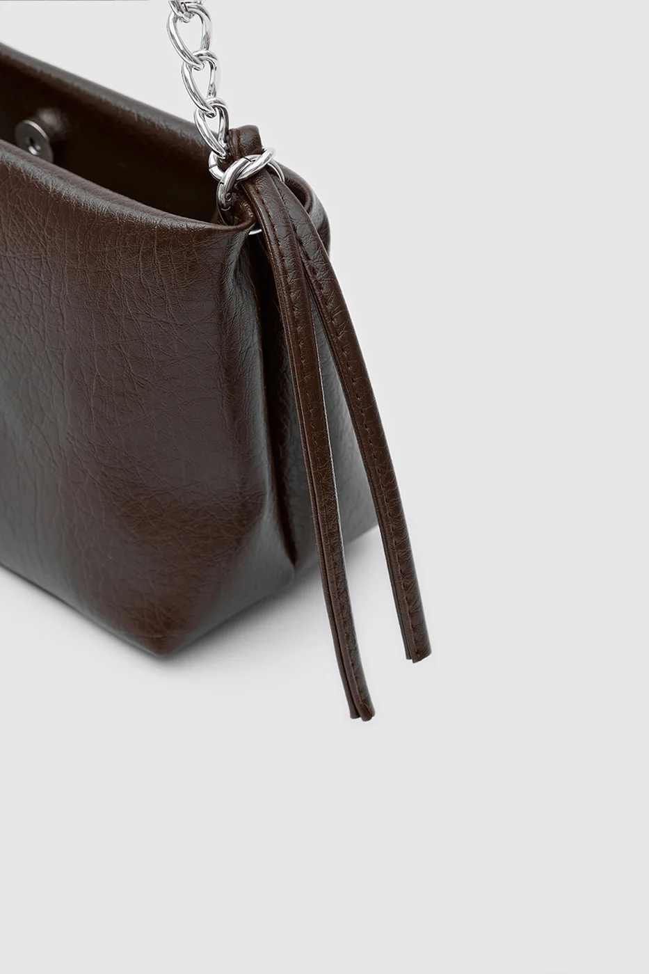 Faux leather crossbody bag with chain detail in brown