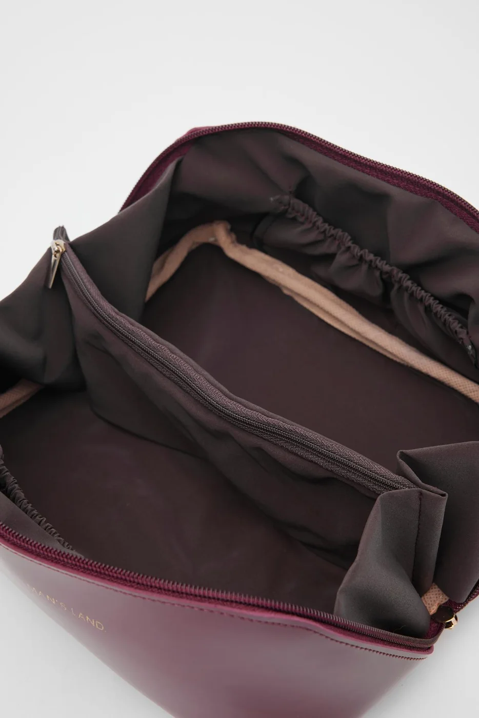 Faux leather cosmetic bag in burgundy