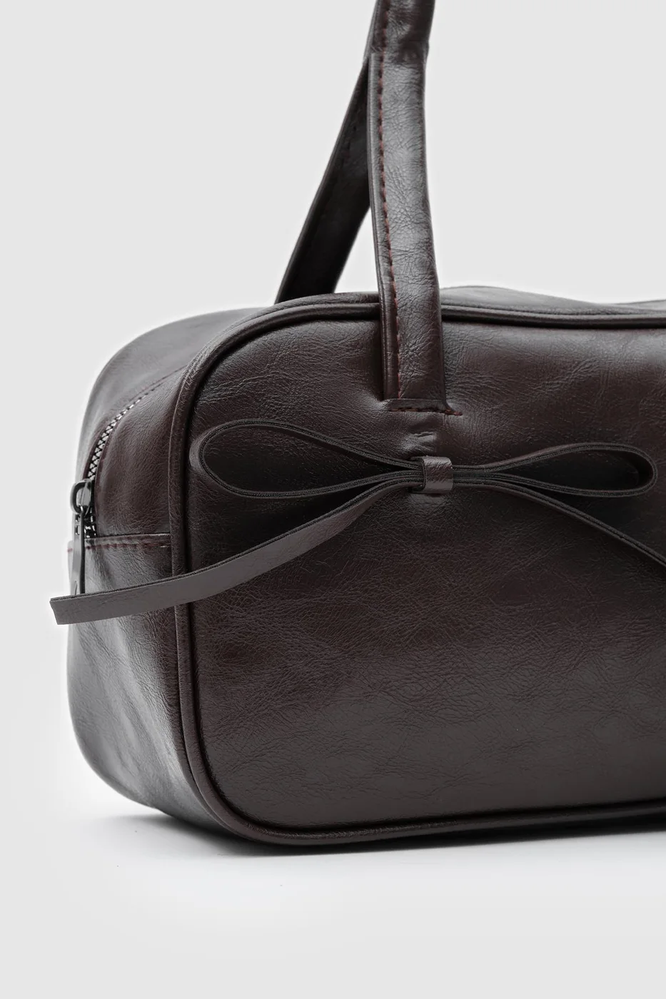 Faux leather baguette bag in dark brown