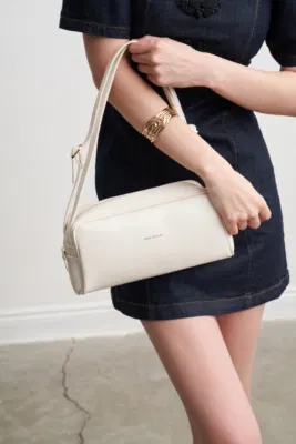 Faux leather baguette bag in cream
