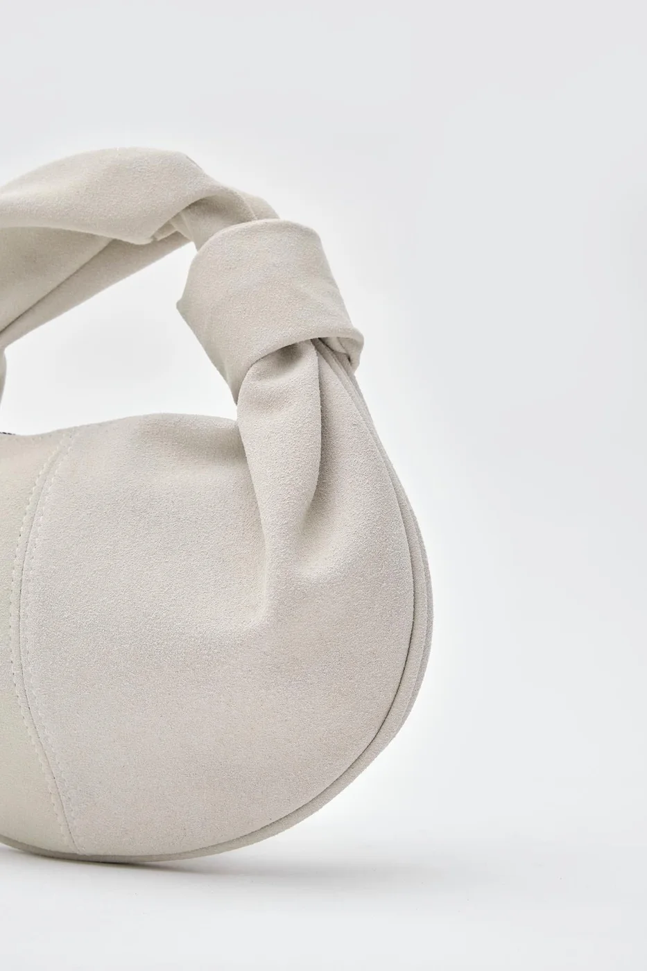 faux suede baguette bag in stone