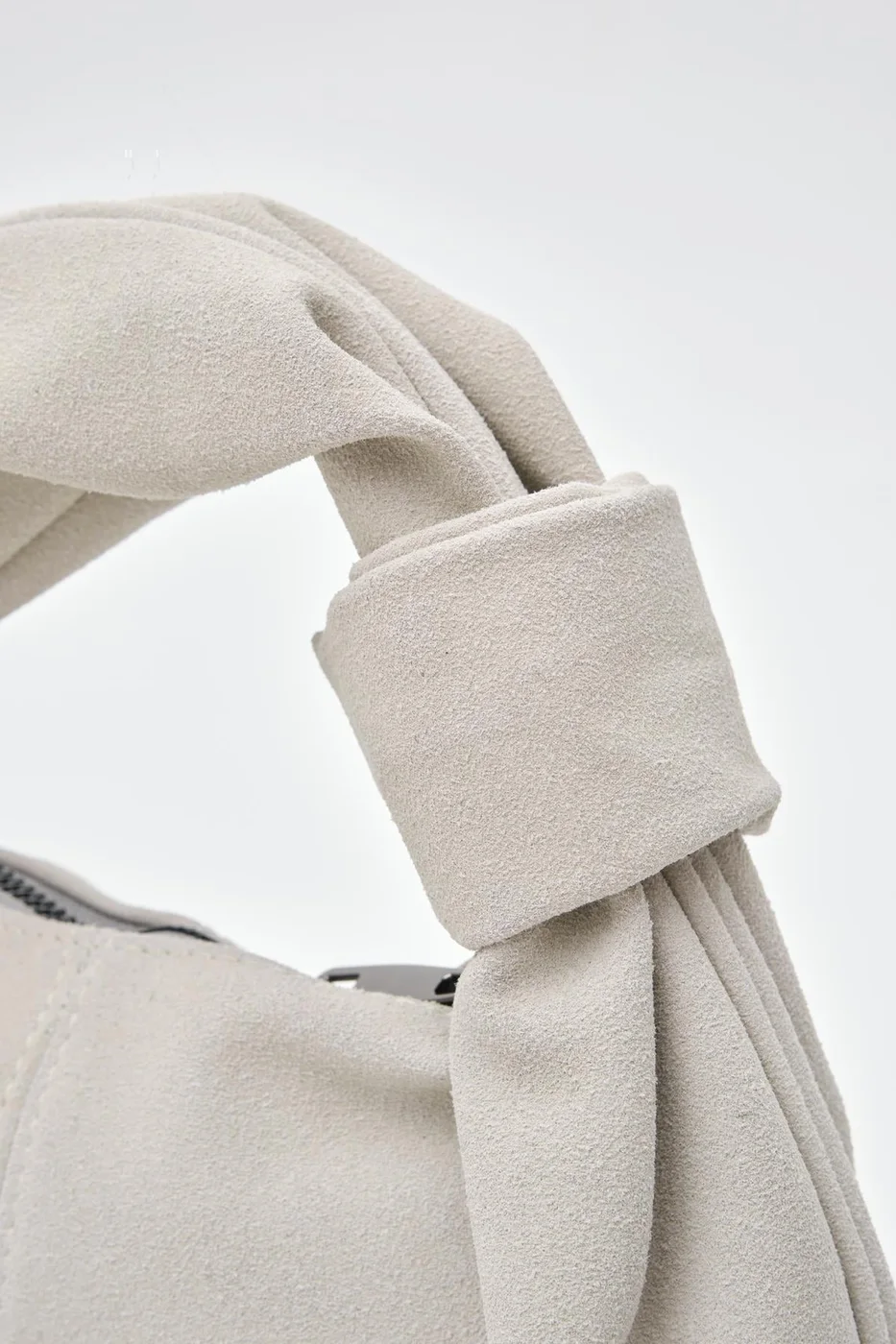 faux suede baguette bag in stone