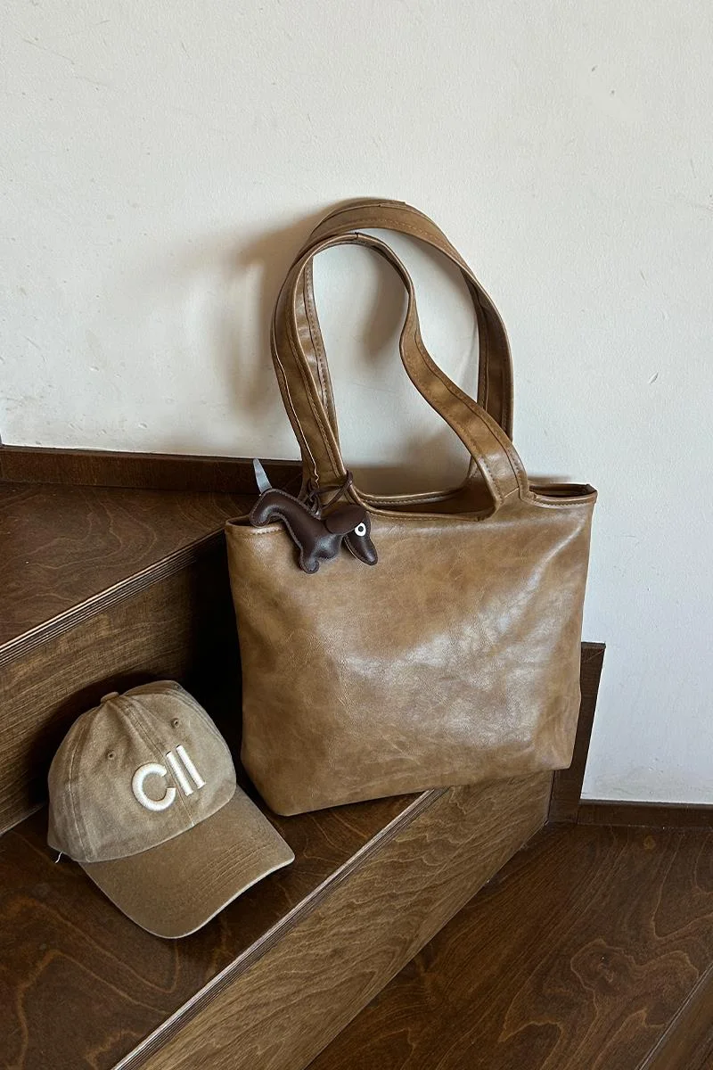 faux leather shoulder bag in taupe