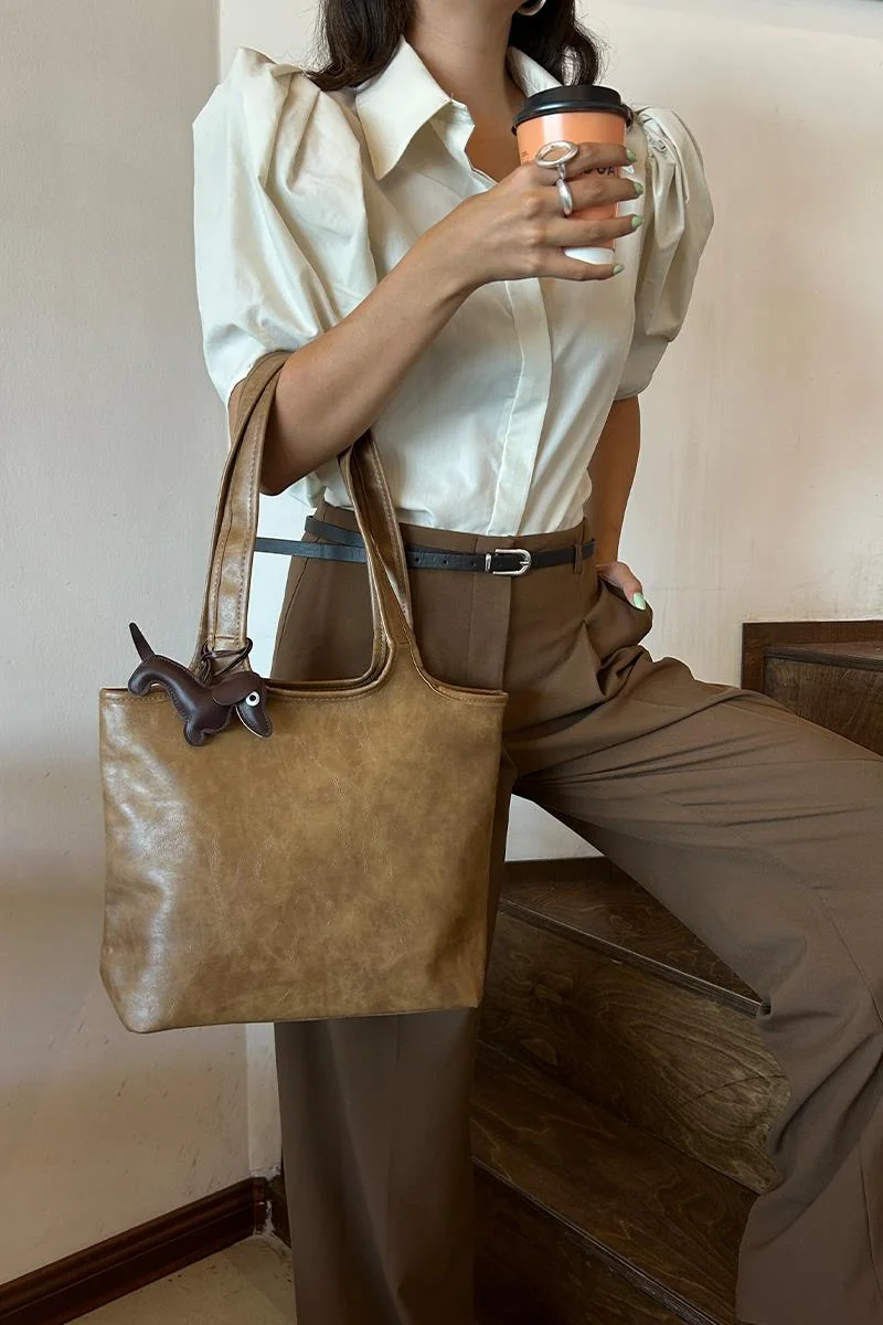 faux leather shoulder bag in taupe