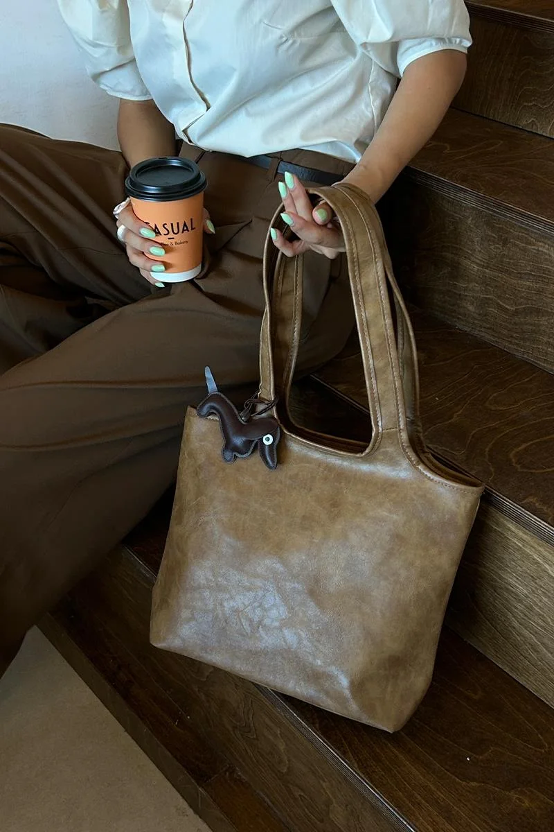faux leather shoulder bag in taupe