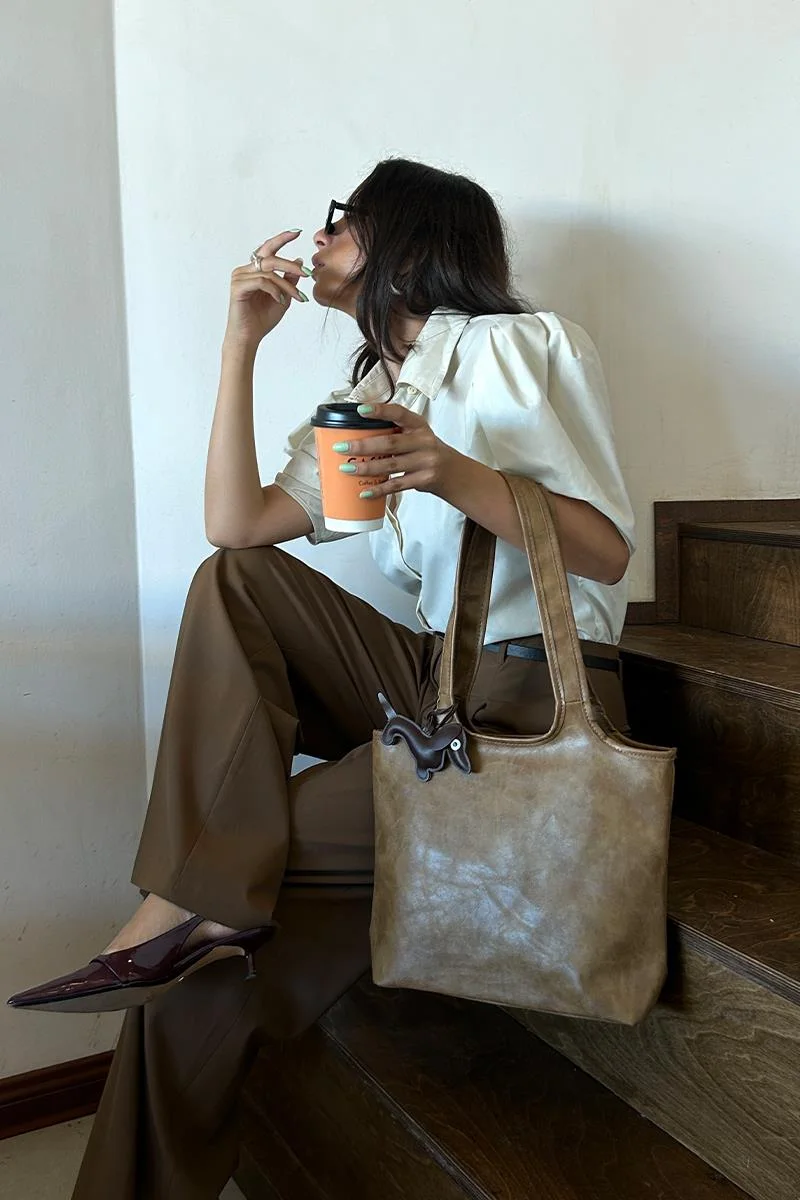 faux leather shoulder bag in taupe