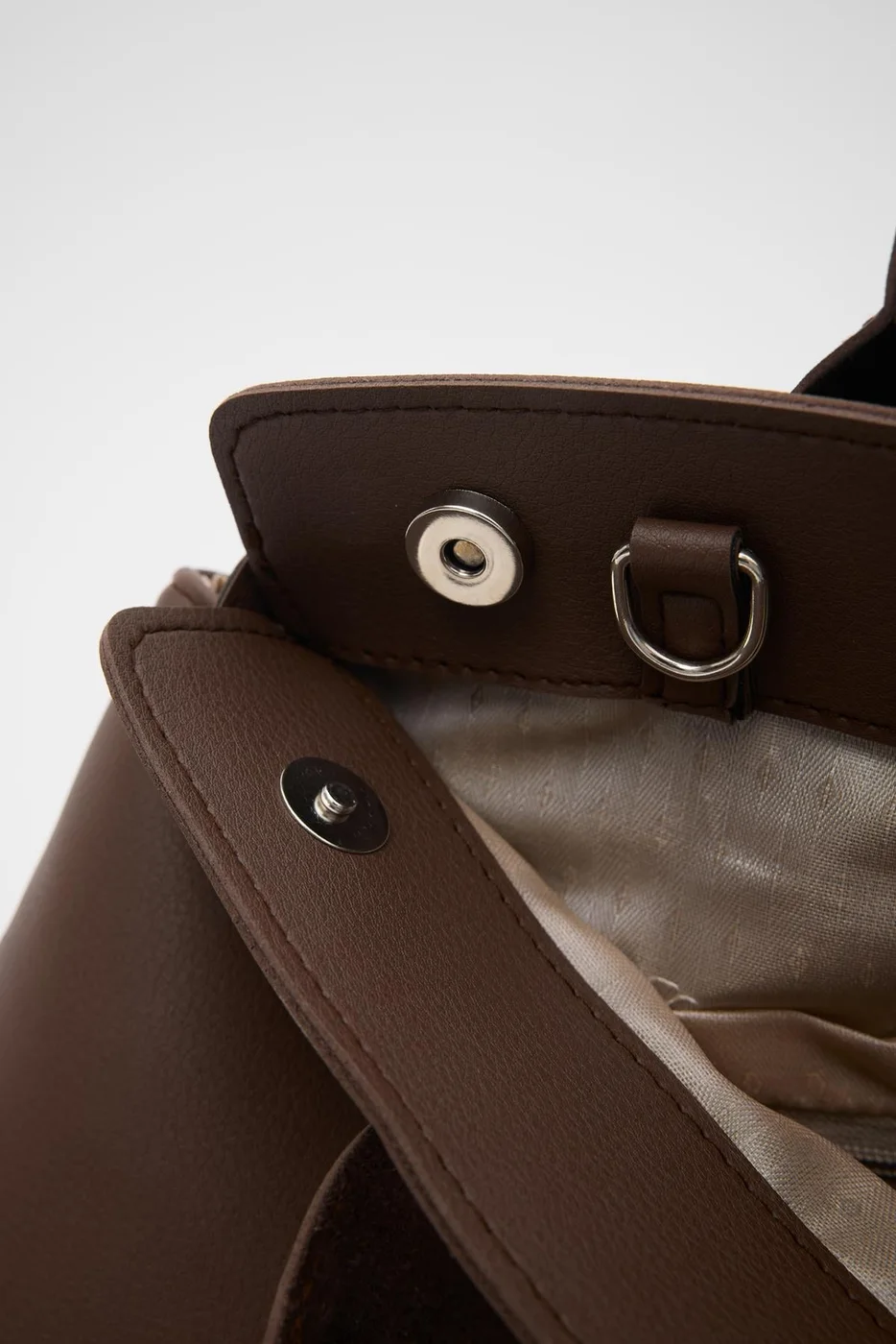 Faux leather shoulder bag with stylish design Faux leather shoulder bag with stylish design in dark brown