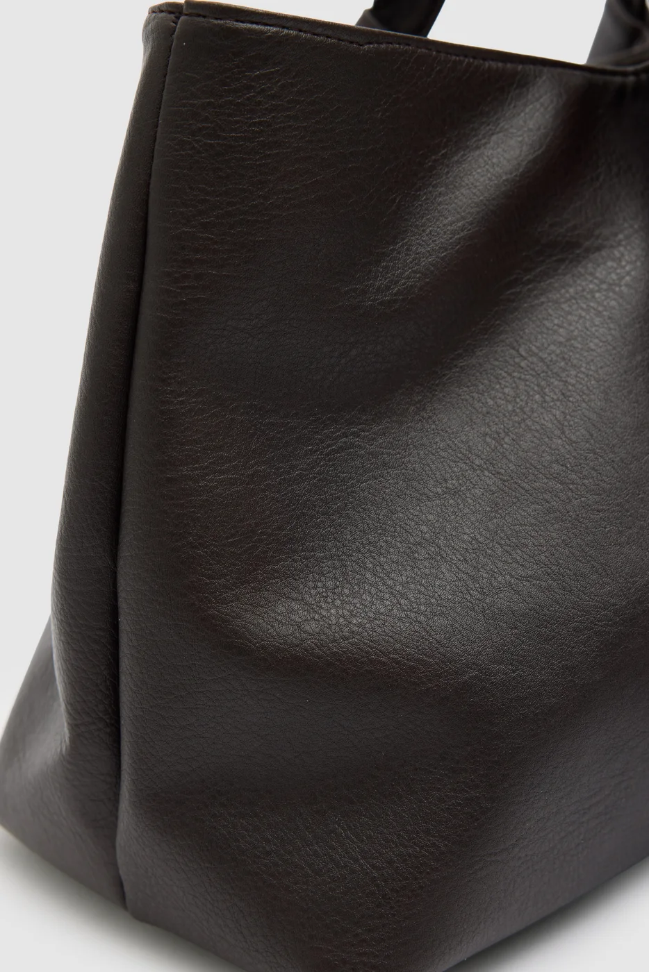 faux leather shoulder bag in dark brown