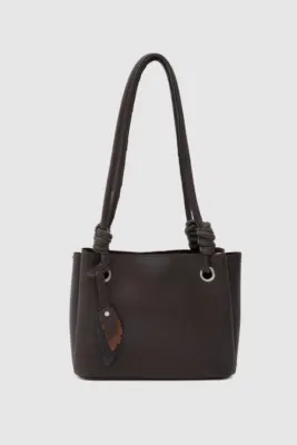 Faux leather shoulder bag with charm detail in dark brown