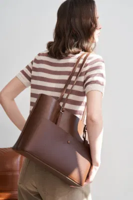 Faux leather shoulder bag set in tan