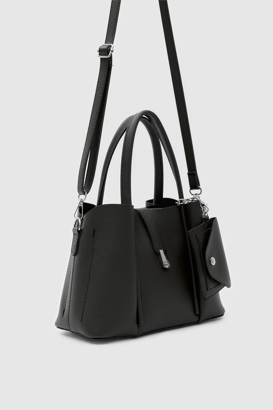 Faux leather shoulder bag with charm in black
