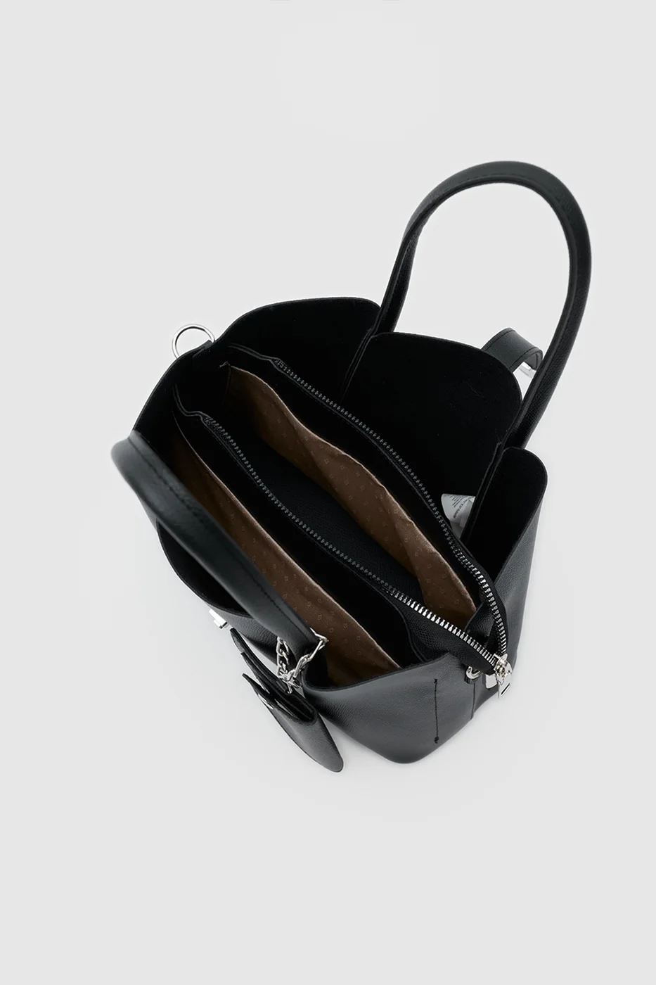 Faux leather shoulder bag with charm in black