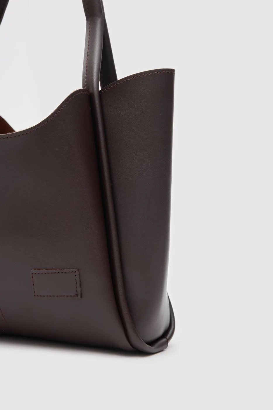 Faux leather shoulder bag in dark brown