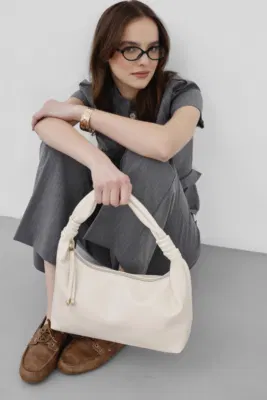 Faux leather shoulder bag in cream