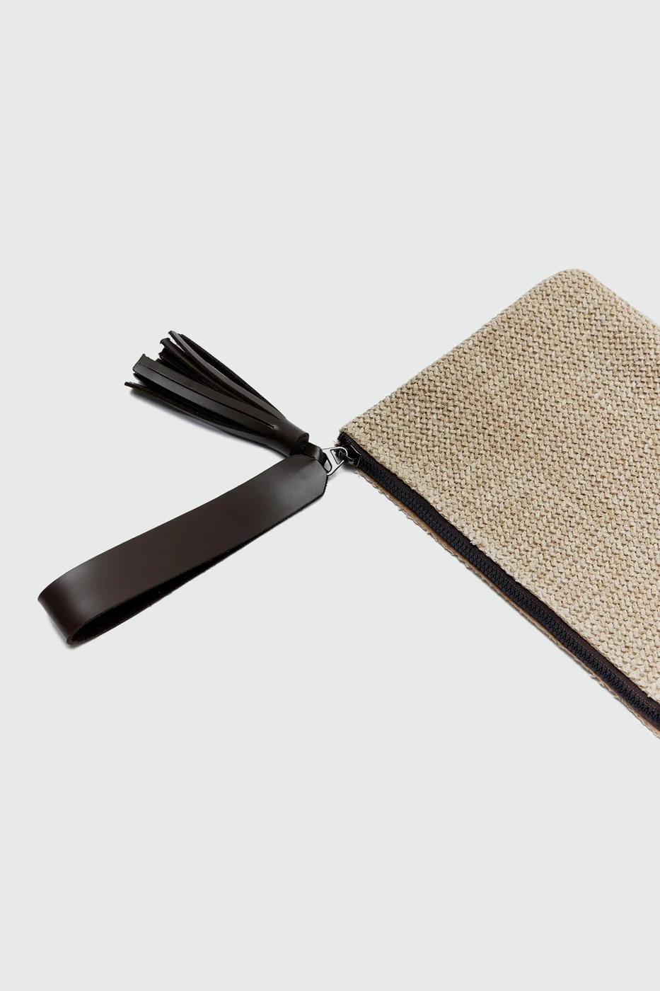 Woven clutch bag with fringe detail in brown