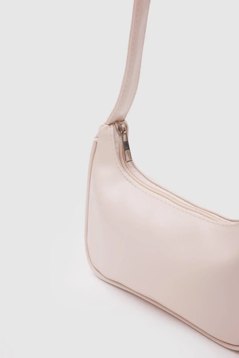 Faux leather baguette bag in cream