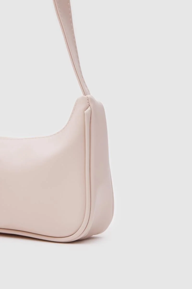 Faux leather baguette bag in cream