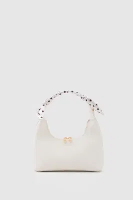 Faux leather crossbody bag with stylish design in cream