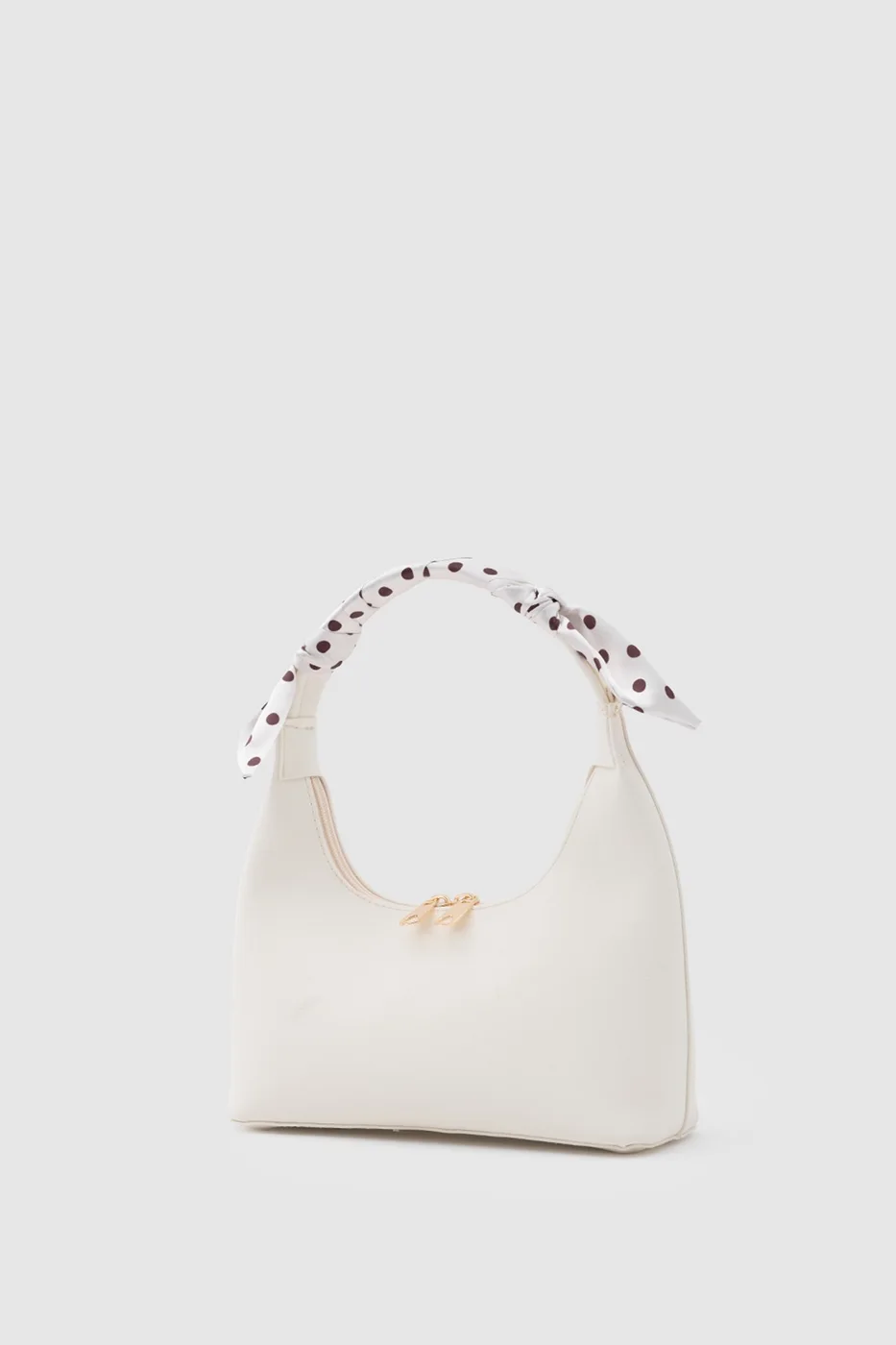 Faux leather crossbody bag with stylish design in cream