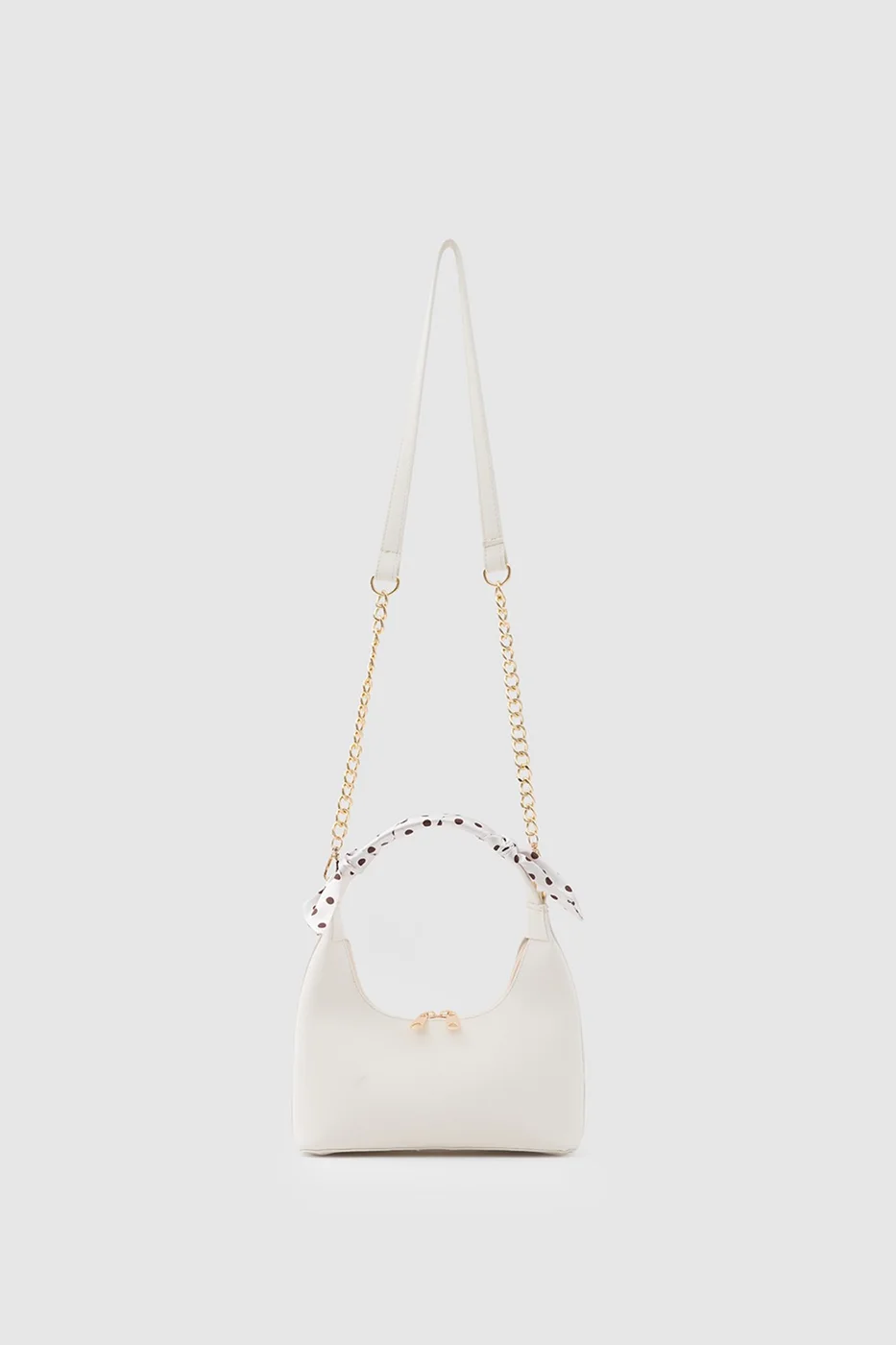 Faux leather crossbody bag with stylish design in cream