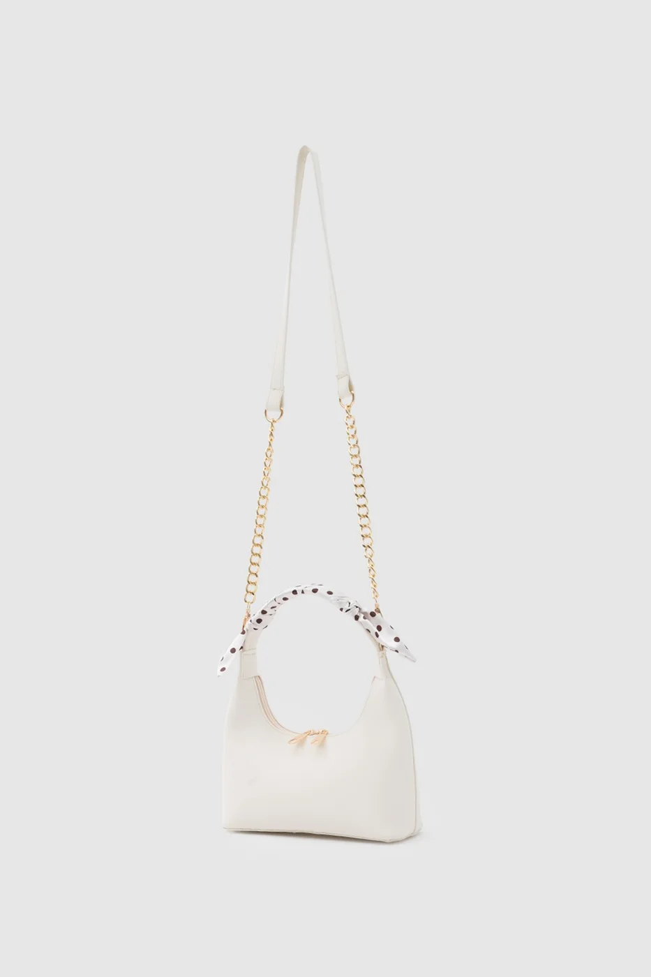 Faux leather crossbody bag with stylish design in cream