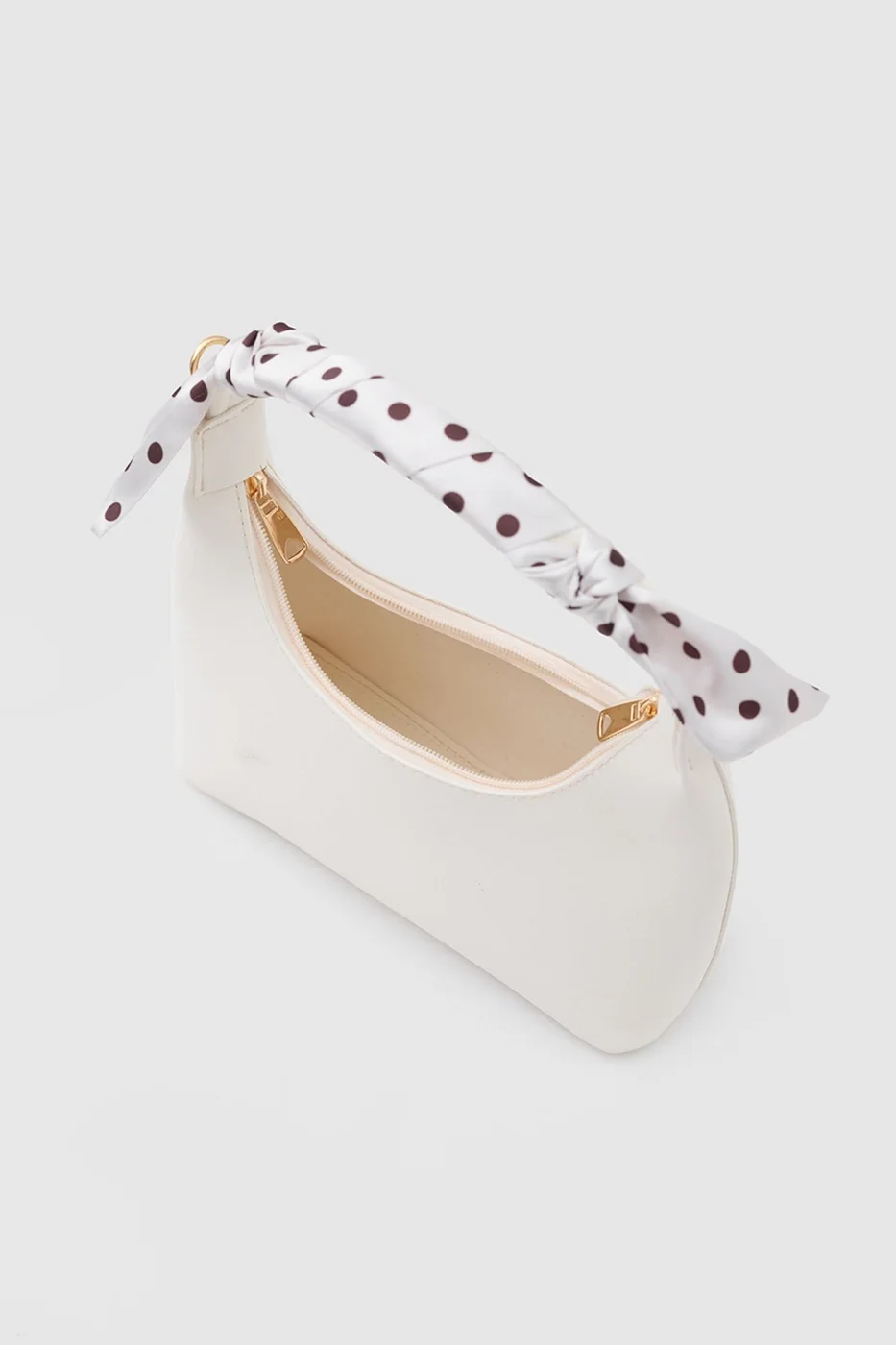Faux leather crossbody bag with stylish design in cream