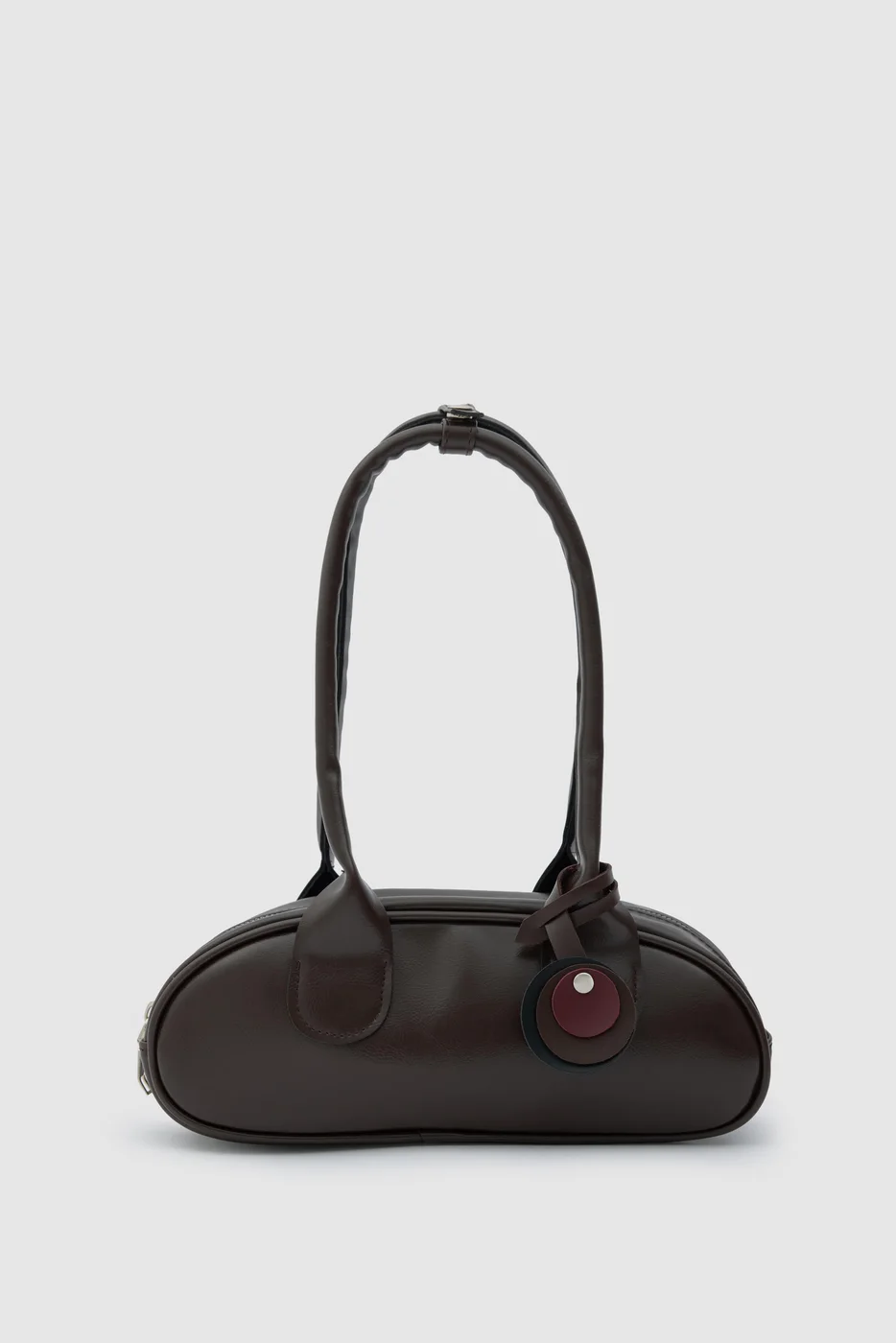 Faux leather baguette bag for stylish outings in dark brown