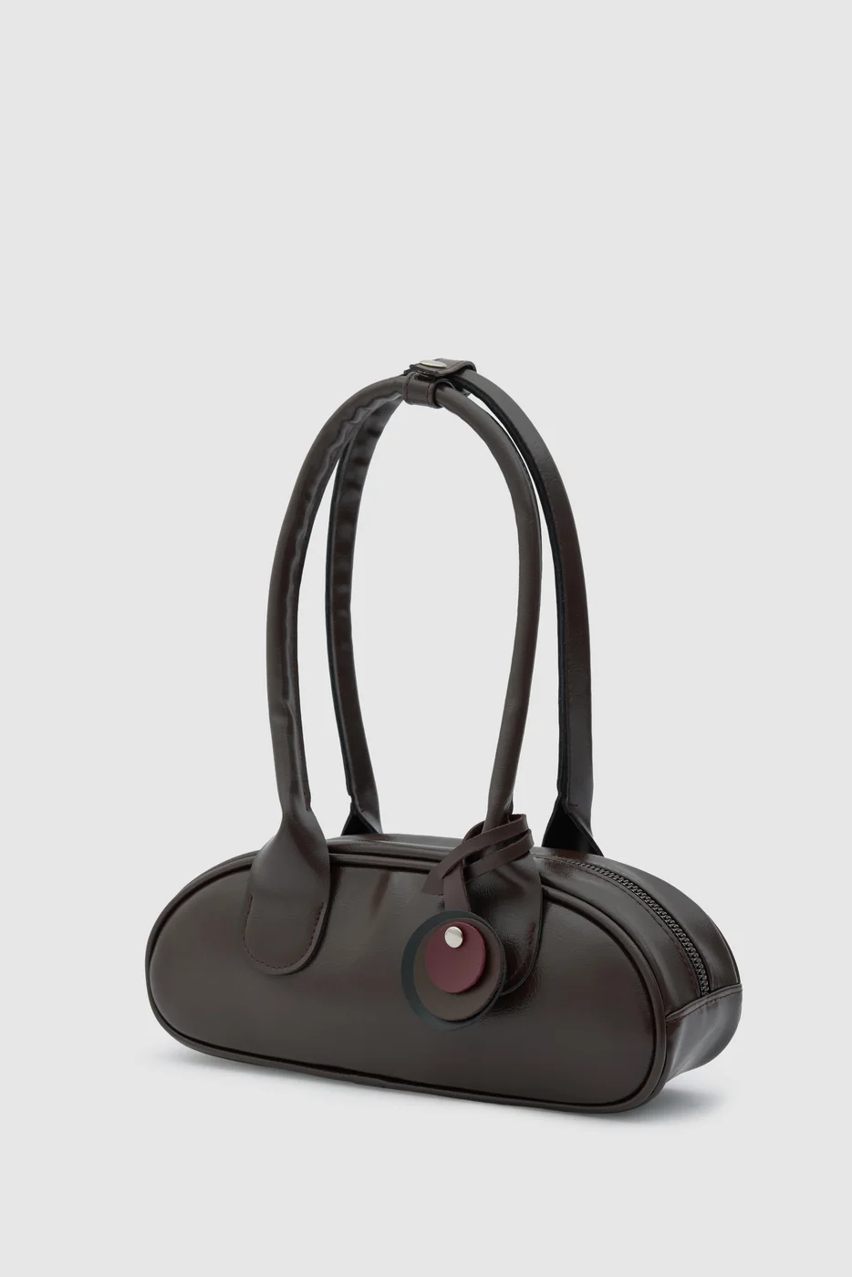 Faux leather baguette bag for stylish outings in dark brown