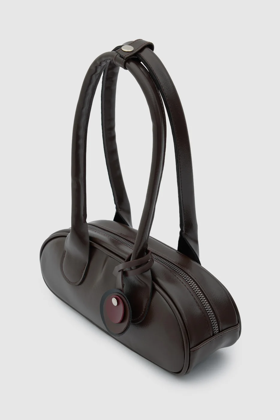 Faux leather baguette bag for stylish outings in dark brown