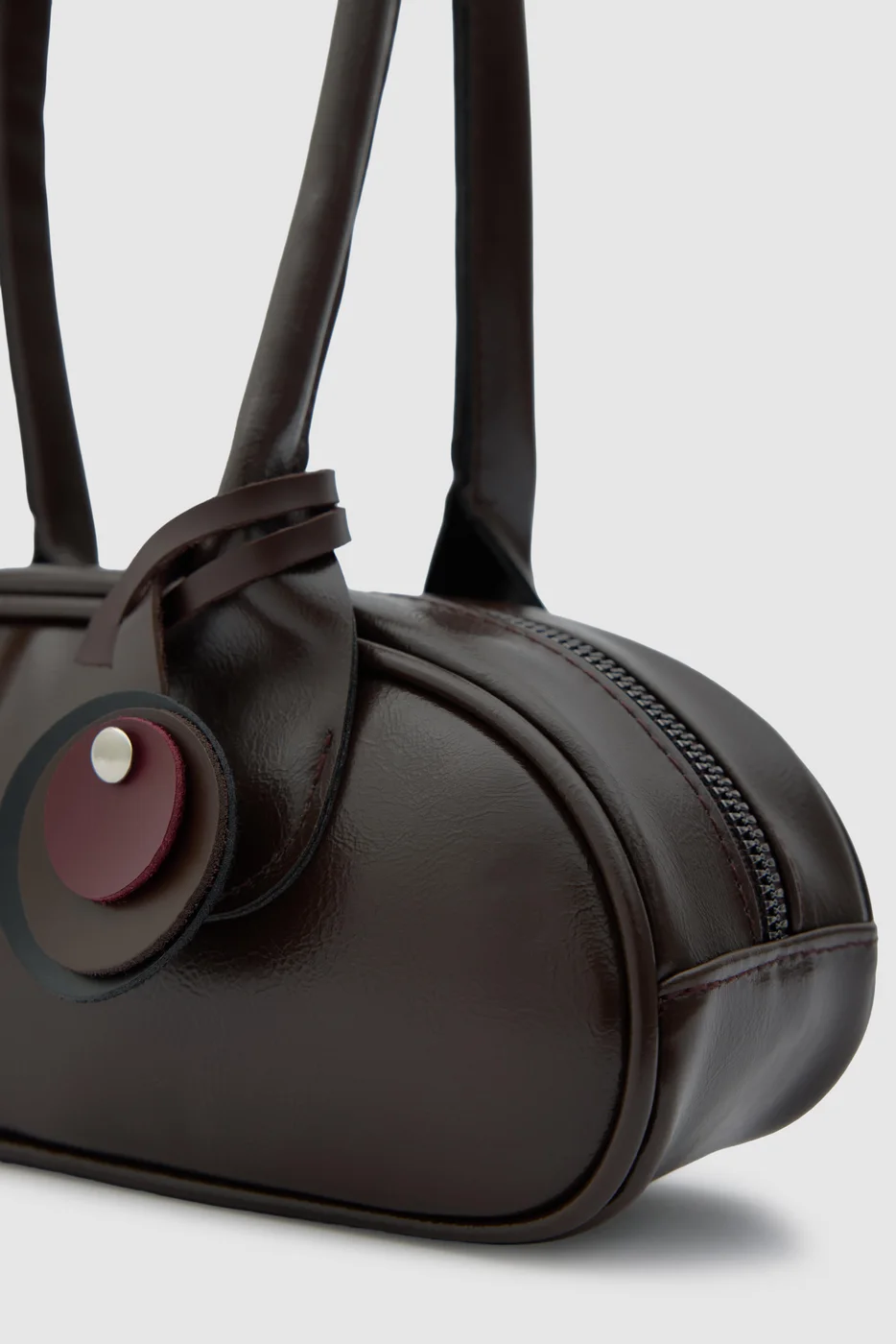 Faux leather baguette bag for stylish outings in dark brown