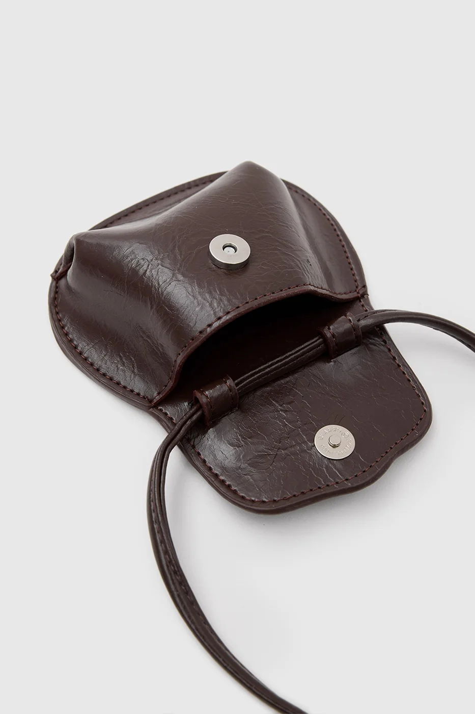 Mini crossbody bag in faux leather in dark brown