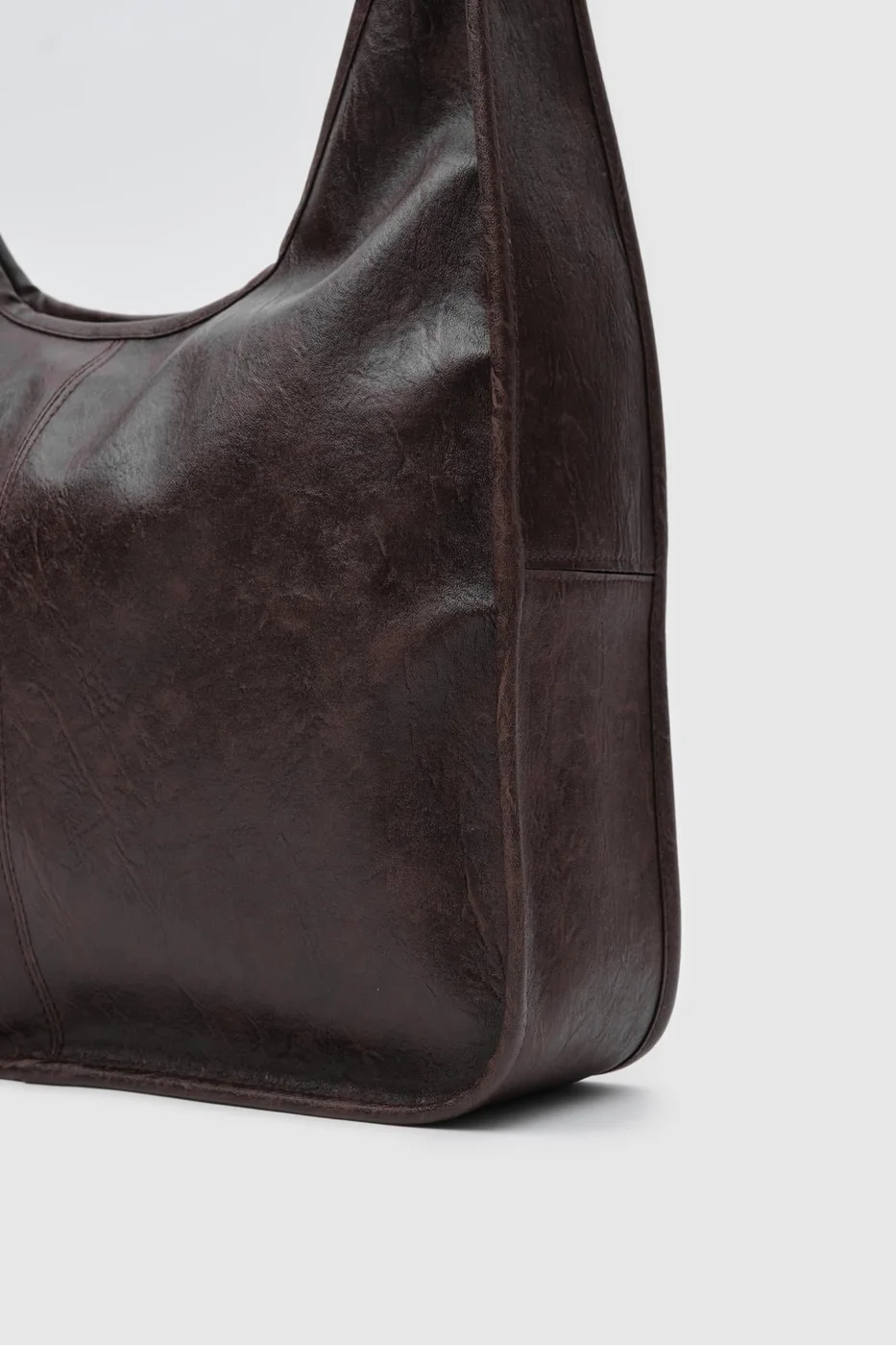 Faux leather shoulder bag in dark brown
