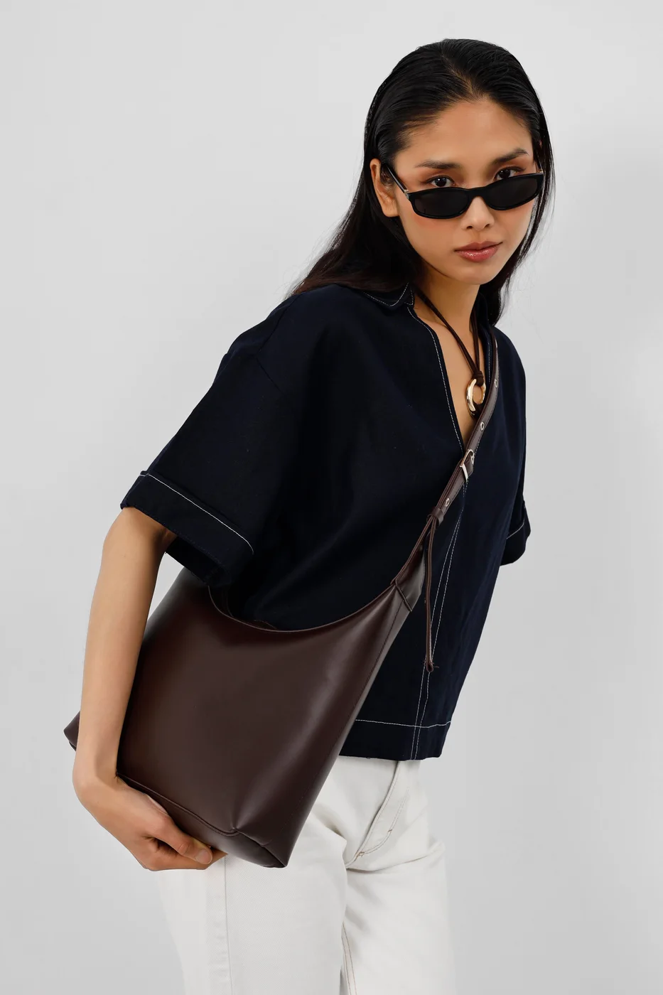 faux leather shoulder bag in dark brown