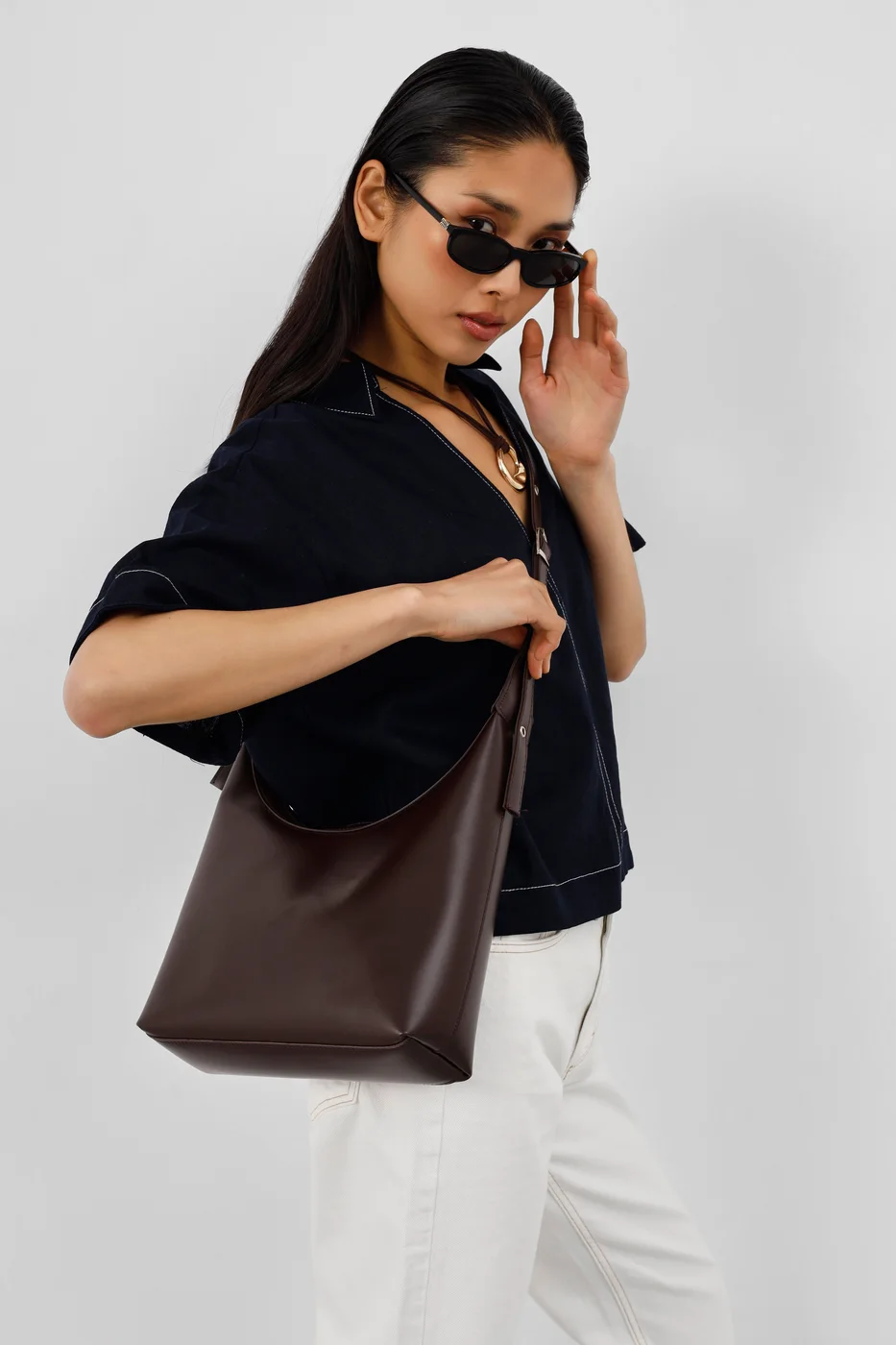 faux leather shoulder bag in dark brown