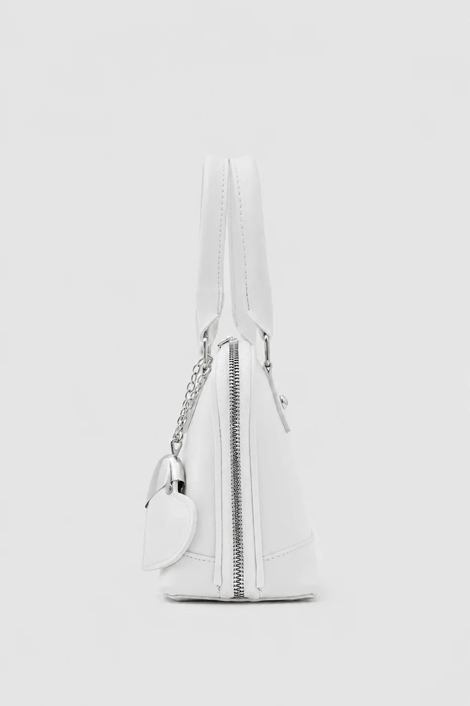 Faux leather crossbody bag with heart charm Faux leather crossbody bag with heart charm in cream