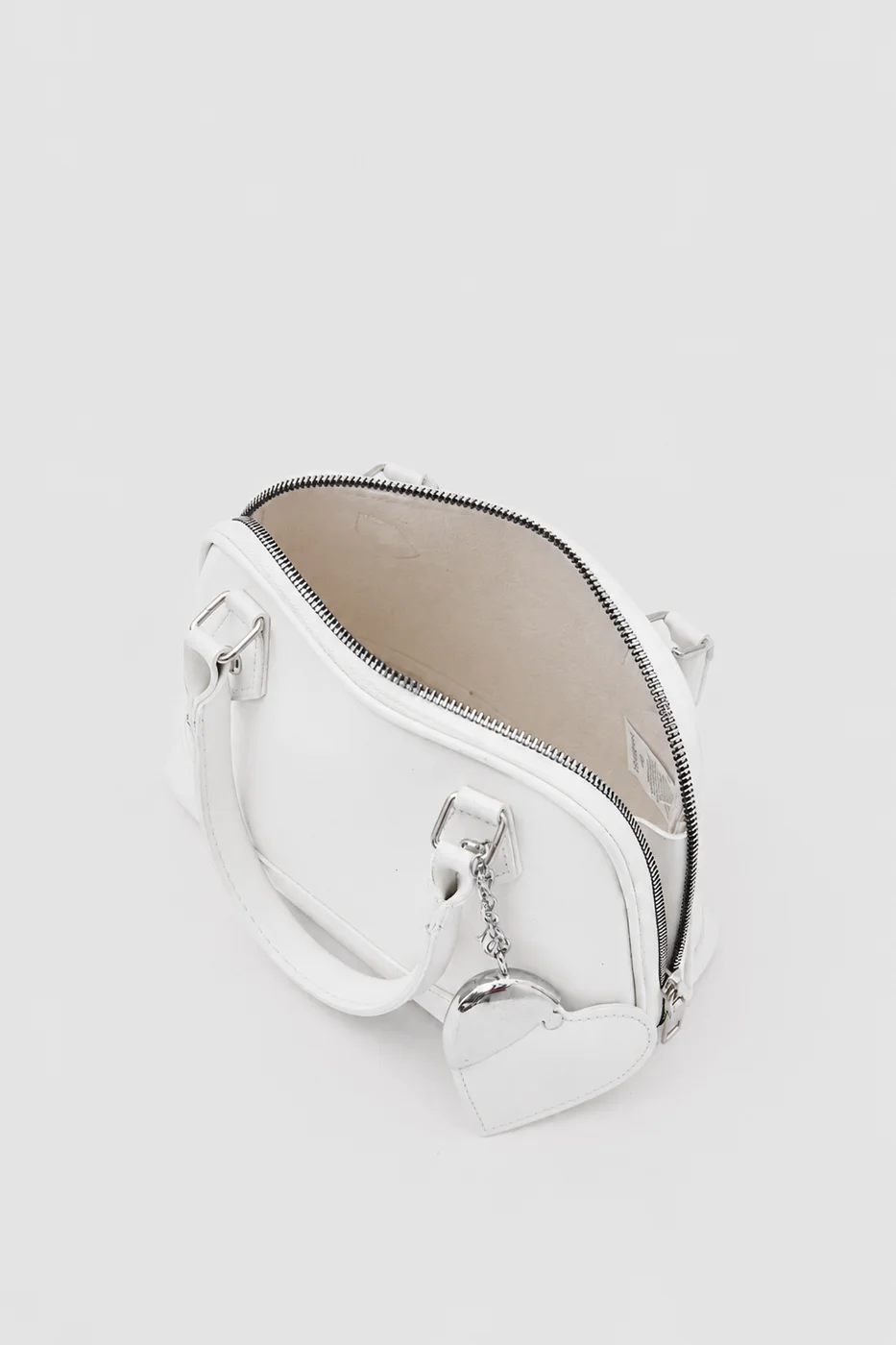 Faux leather crossbody bag with heart charm Faux leather crossbody bag with heart charm in cream