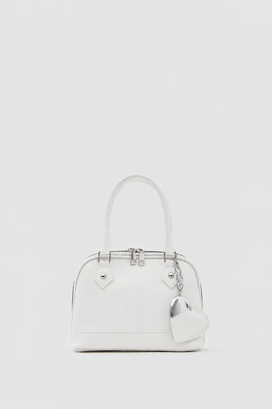 Faux leather crossbody bag with heart charm Faux leather crossbody bag with heart charm in cream