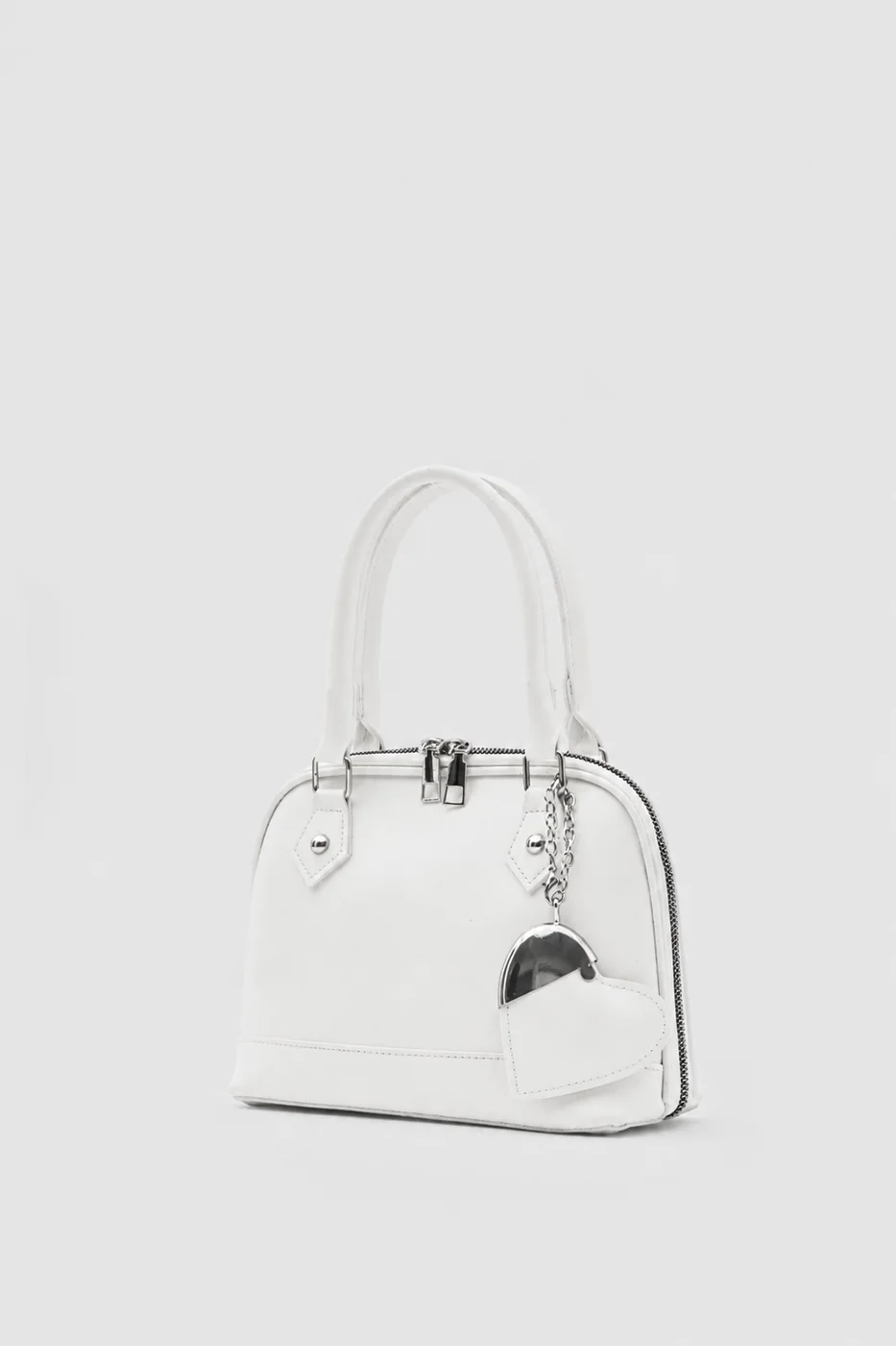 Faux leather crossbody bag with heart charm Faux leather crossbody bag with heart charm in cream