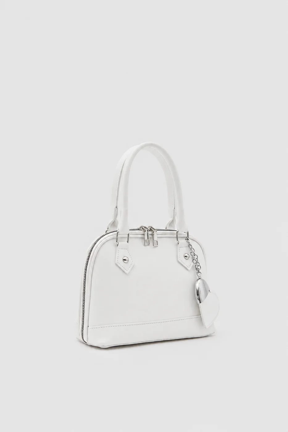 Faux leather crossbody bag with heart charm Faux leather crossbody bag with heart charm in cream