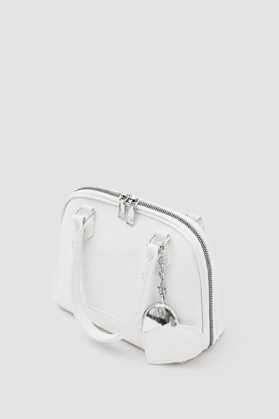 Faux leather crossbody bag with heart charm Faux leather crossbody bag with heart charm in cream