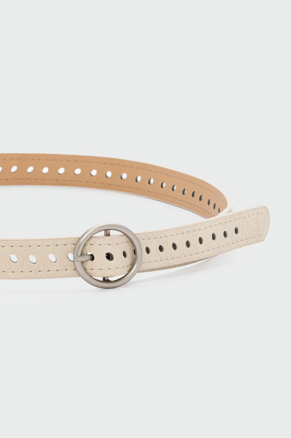 perforated faux leather belt in cream