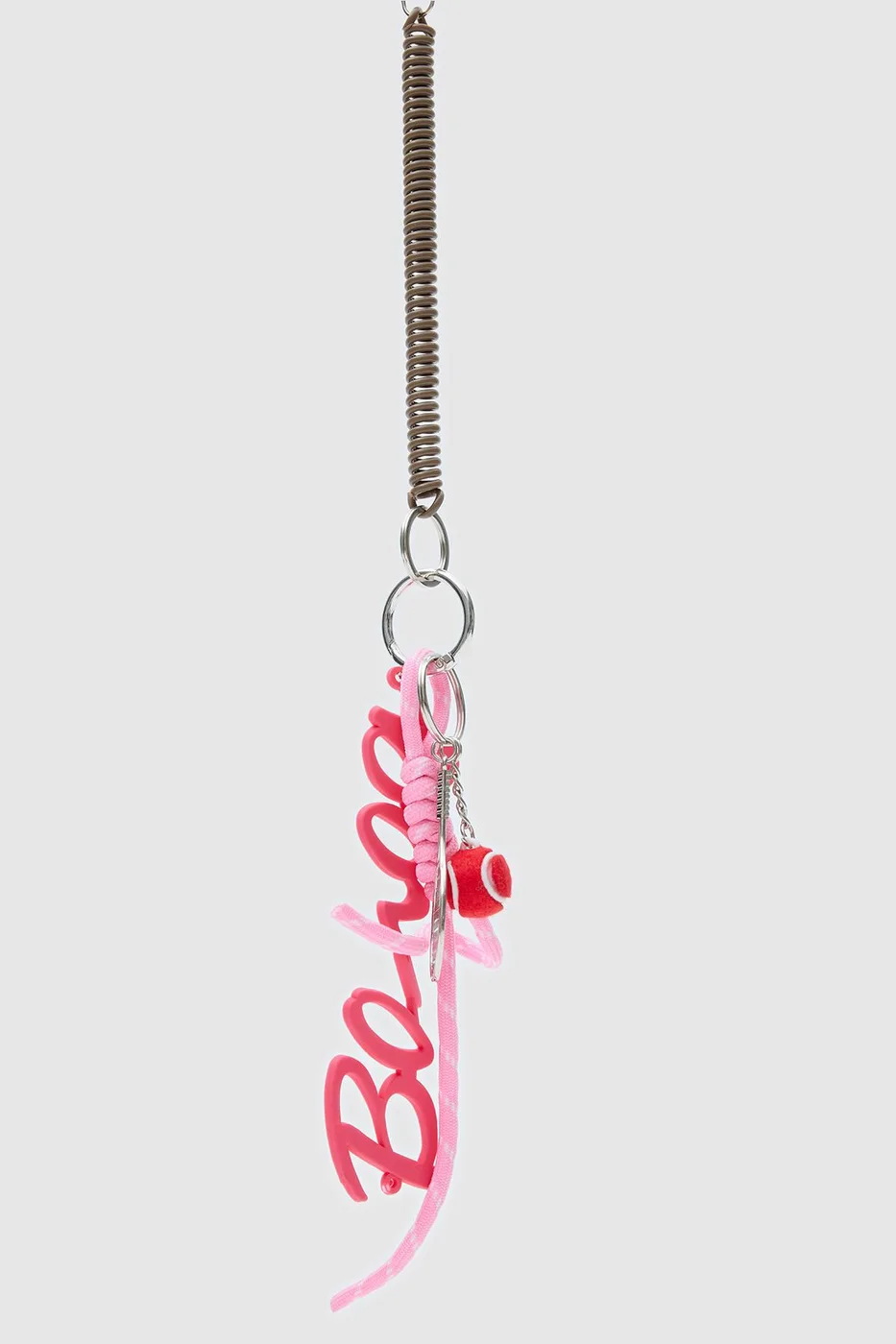 Bag charm featuring a tennis ball design Bag charm featuring a tennis ball design